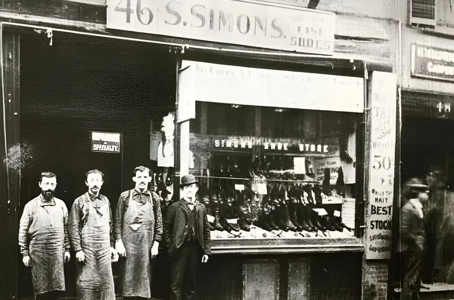 S. Simons Shoes storefront in 1892 with the shopkeepers out front